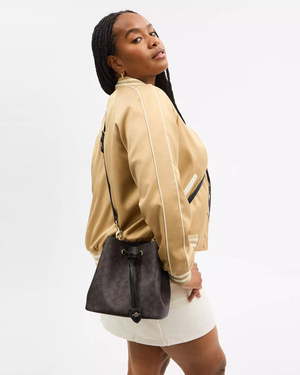 Rowan Bucket Bag In Signature Canvas